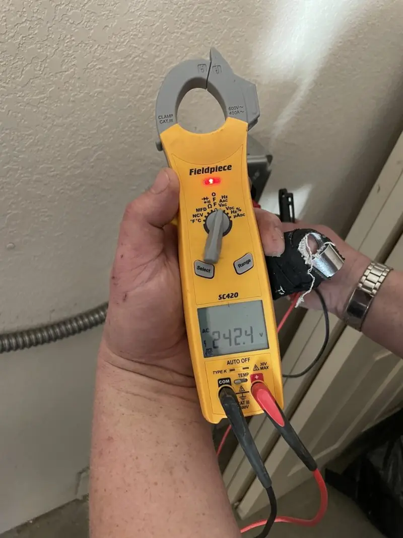 Voltage testing with clamp meter during Recessed Lighting Installation in Timonium
